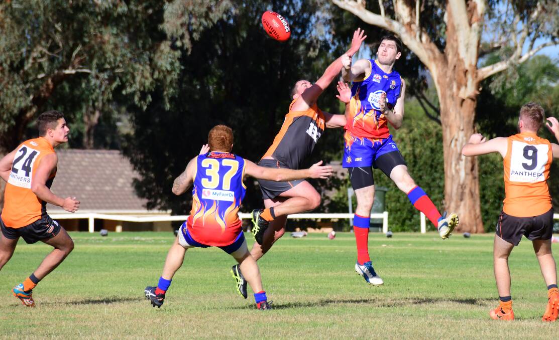 GOING AGAIN: Josh Anasis takes on the Bathurst Giants earlier in the season. The two sides will meet again in this weekend's minor semi. Photo: AMY McINTYRE