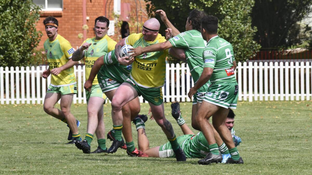 The Dubbo CYMS defence works to bring down Orange CYMS captain-coach Ethan McKellar on Saturday. Picture by Carla Freeman
