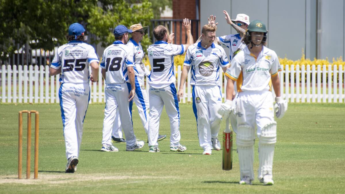 Macquarie players celebrate a wicket for Blake Smith during their strong day one performance on Saturday. Picture by Belinda Soole