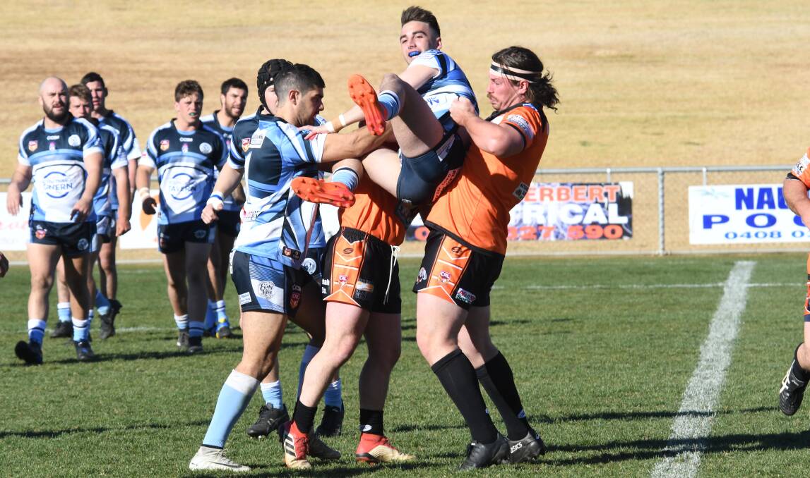 Macquarie came from 14-0 down to win on Sunday. Photos: AMY McINTYRE