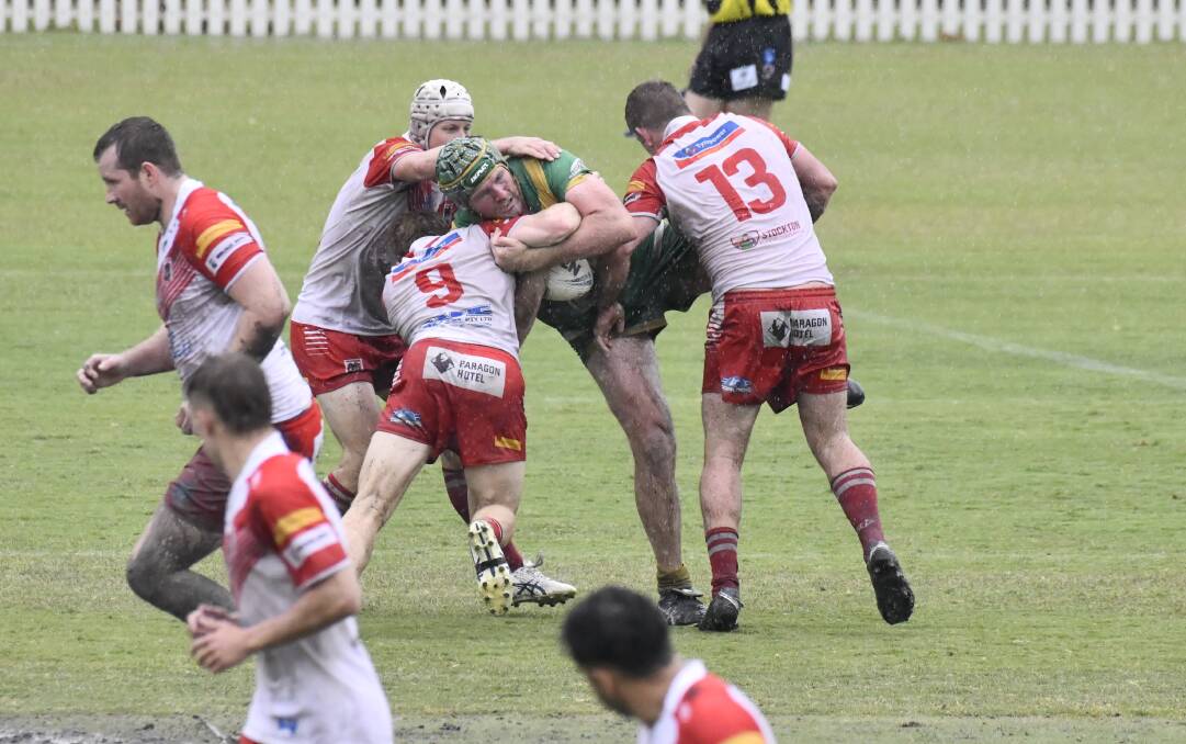 The Orange CYMS defence was made to work hard at a wet Wade Park in round three. Picture by Jude Keogh