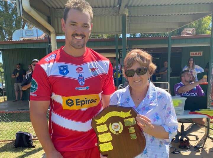 SPECIAL VICTORY: Narromine Jets captain Alex Sambrook with the wife of Norm Newman, Pauline, after Saturday's trial win at Cale Oval. Photo: NARROMINE JETS FACEBOOK