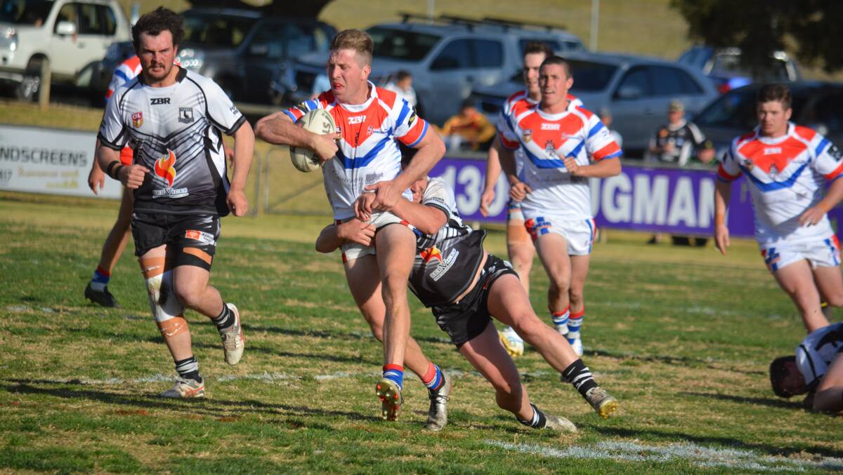 MASSIVE MATCH: Brandon Paige in action for Parkes against Forbes last year. The derby clashes between the two are some of the biggest in Group 11. Photo: NICK GUTHRIE