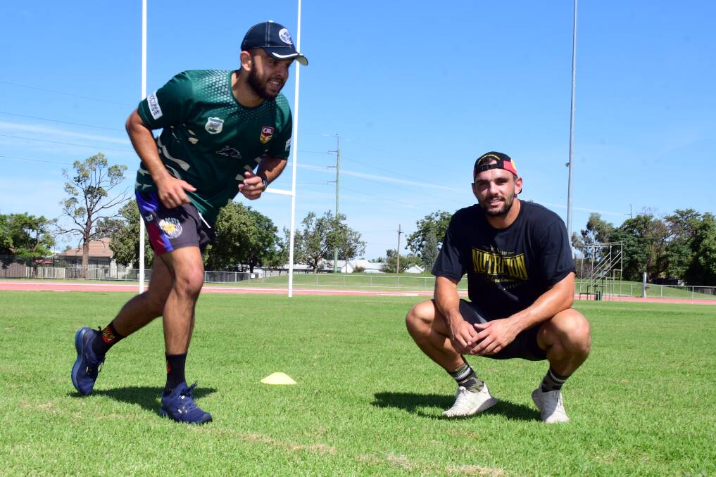 WORKING: Josh Toole (right), pictured with Raiders captain-coach Alex Ronayne, wants people to be active and supported. Photo: BELINDA SOOLE