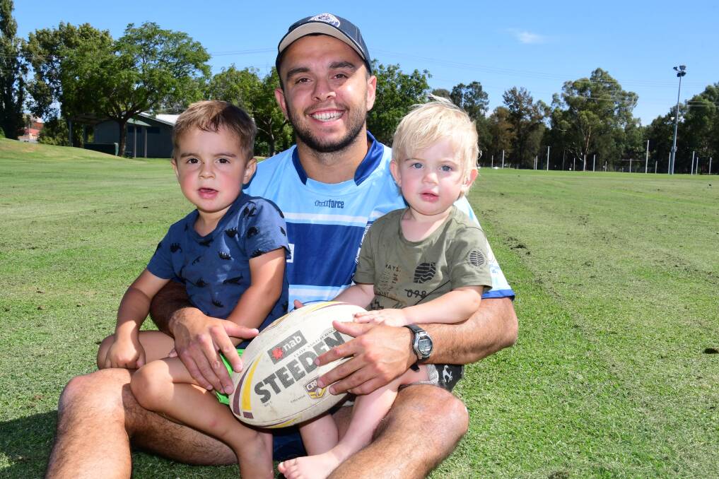 HAVING A BALL: Alex Ronayne, pictured with his sons Alex Jnr (left) and Cooper, has made a strong start to life as Macquarie captain-coach. Photo: BELINDA SOOLE