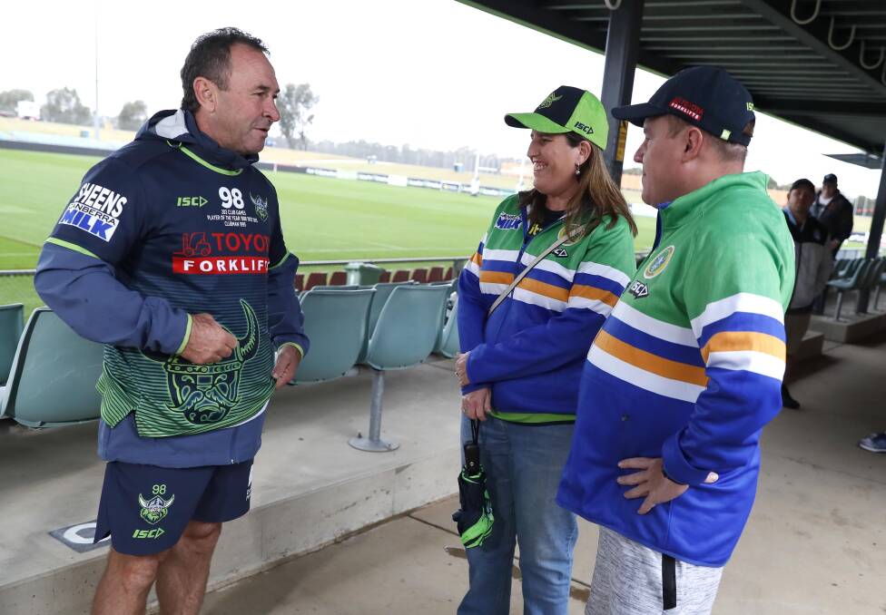 Canberra coach Ricky Stuart with Raiders fans Emily Bartley and Scott Gerhardy in Wagga in April of this year. Picture: Les Smith