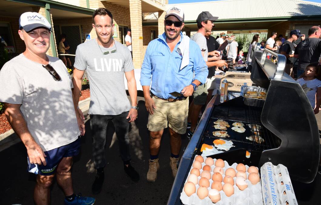 Perry Meredith's father Mark, Sam Webb and Johno Aird at a past Tradies Breakfast run in conjunction with the LIVIN organisation. Picture: Belinda Soole