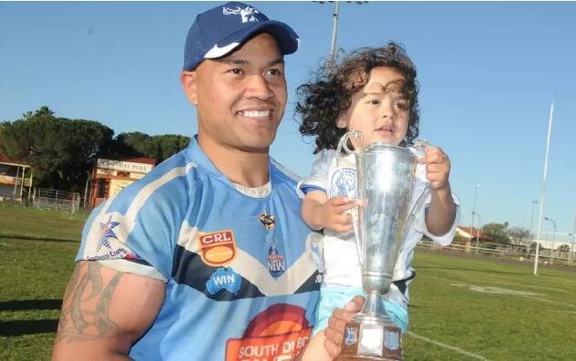 Moses Manu and son Kobe celebrate a Group 11 grand final win. File picture