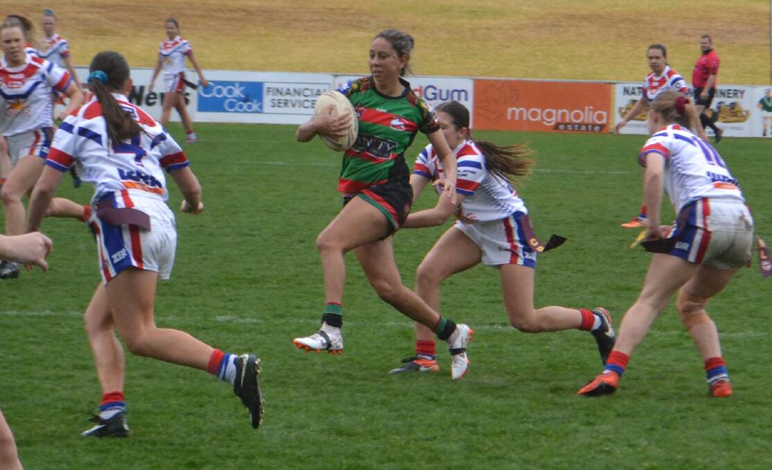 TRYING: Westside halfback Tarlee Roberts attempts to work her way through the Parkes Spacecats defence during last weekend's major semi-final. She'll be key again on Sunday. Photo: NICK GUTHRIE