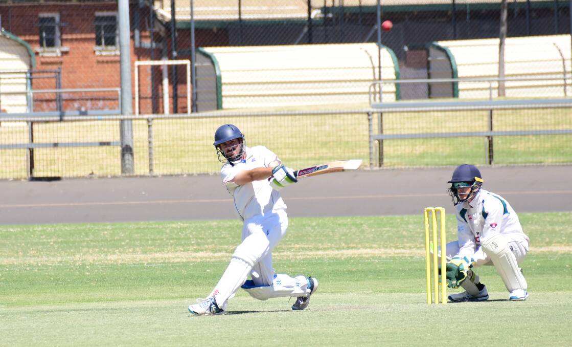 HITTING OUT: Myles Smith made an impact with bat and ball in Macquarie's win on Saturday. Photo: AMY McINTYRE
