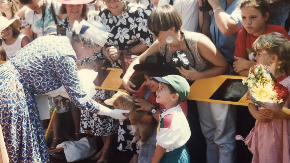Kris Luzuriaga (now Stevens) with children Nik and Steven, Questa the corgi puppy, and Queen Elizabeth II during the 1992 visit to Dubbo. Picture supplied