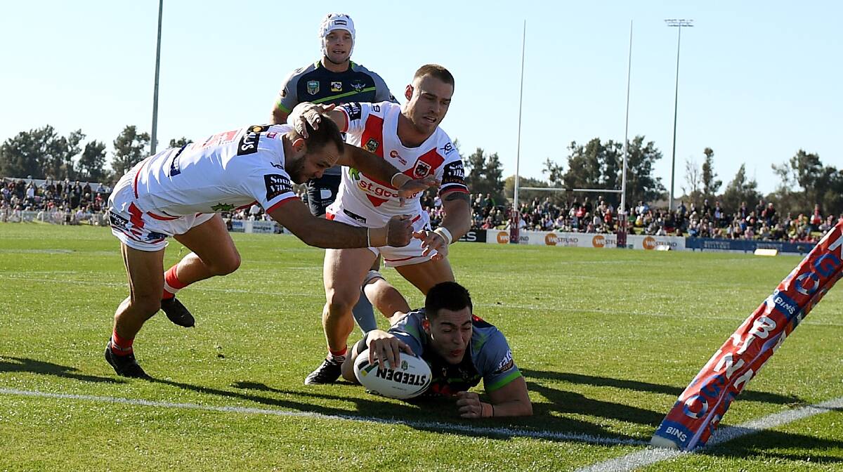 BACK AGAIN: The St George Illawarra Dragons were unable to stop Nic Cotric scoring at Glen Willow last season but still enjoyed their time in Mudgee. Photo: AAP/DAN HIMBRECHTS