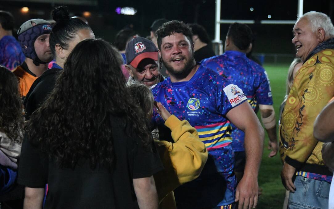 Josh Merritt was swamped by family and friends after kicking the match-winning field goal on Saturday night. Picture by Nick Guthrie