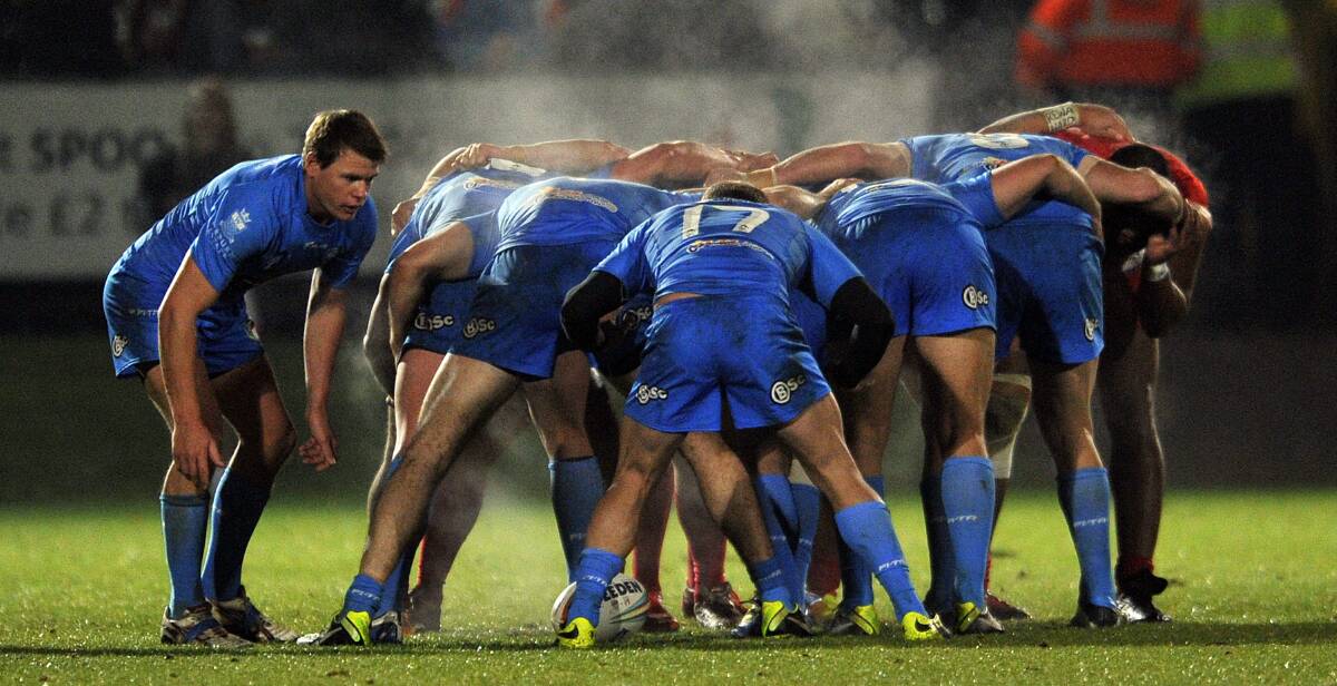 AZZURI: The Italian rugby league side, pictured packing down a scrum against Tonga at the World Cup in England in 2013, takes on the Western Rams at Bathurst's Carrington Park on Saturday. Photo: GETTY IMAGES