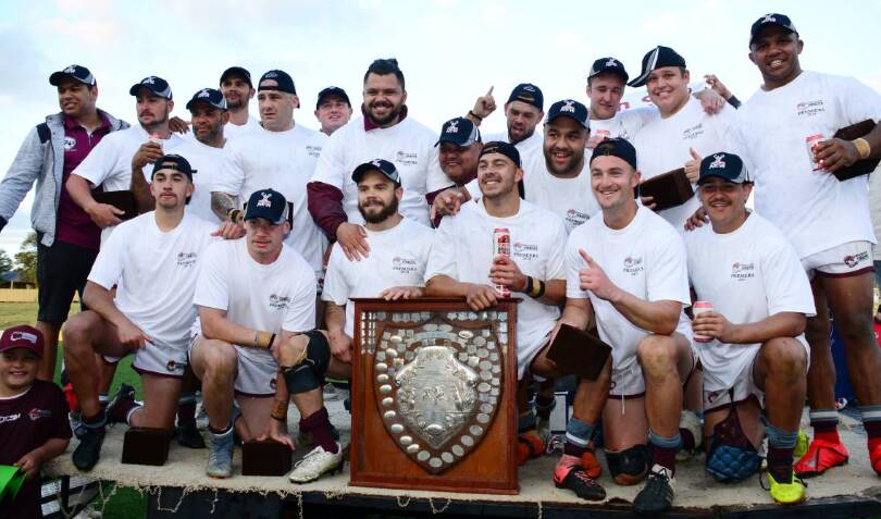SPECIAL: Brock Naden (front row, second from left) and the Wellington Cowboys after last year's grand final win. Photo: BELINDA SOOLE