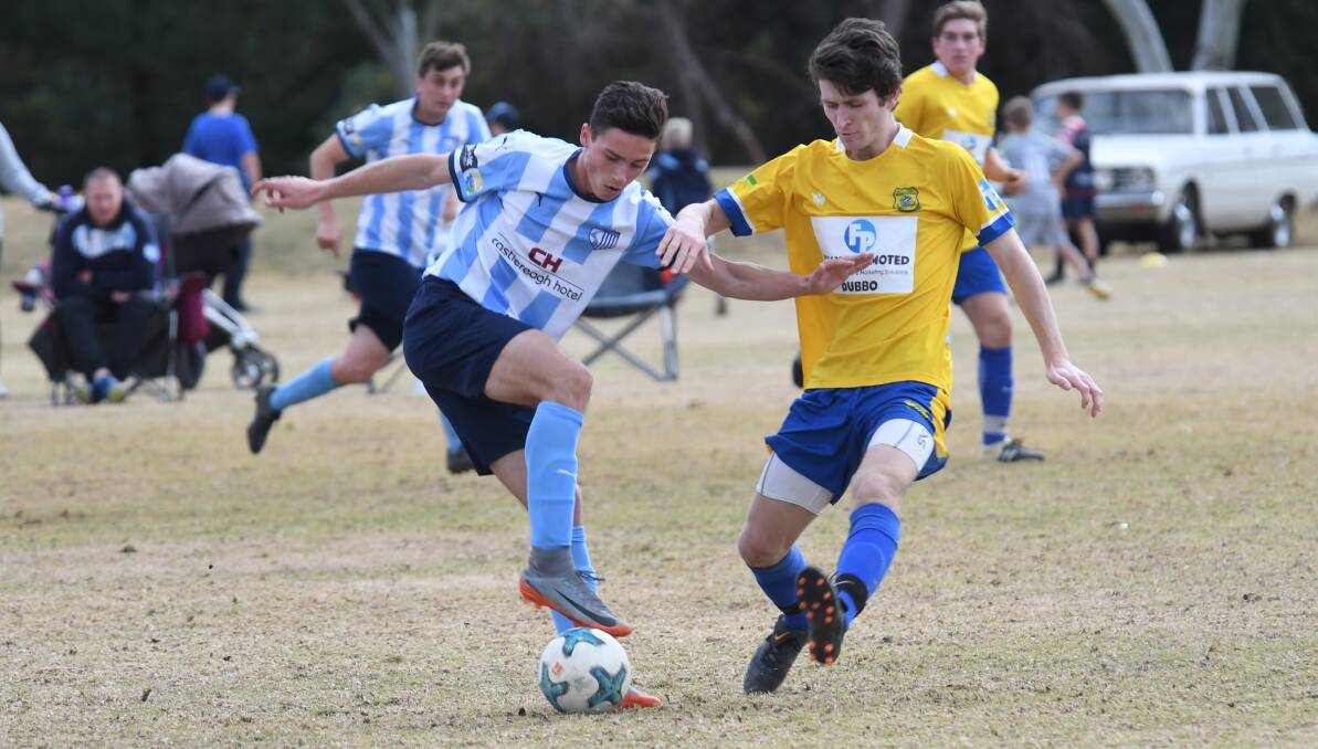 THREAT: Will Grant (left) has developed into a key figure for Macquarie United this season. Photo: AMY McINTYRE