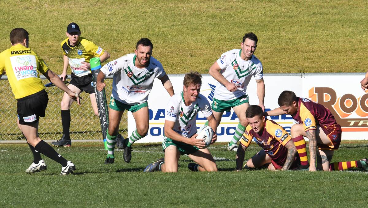 TOO GOOD: Wade Kavanagh (centre) celebrates a try during CYMS' Challenge Cup final win in 2018. Photo: AMY McINTYRE