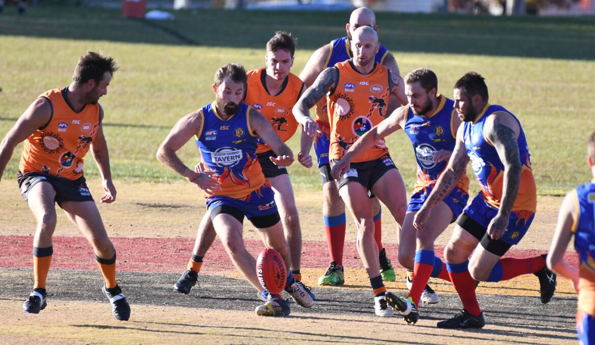 WINNING: Mick Daly (centre) and the Demons lost to the Giants earlier in the year but turned the result around on Saturday. Photo: CHRIS SEABROOK