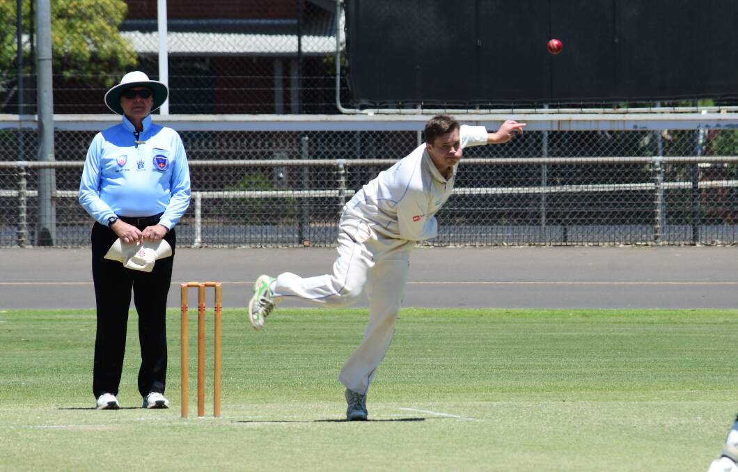 CHIPPING IN: Dan Medway opened the bowling with his spin for Macquarie on Saturday and claimed a wicket with the new ball. Photo: BELINDA SOOLE