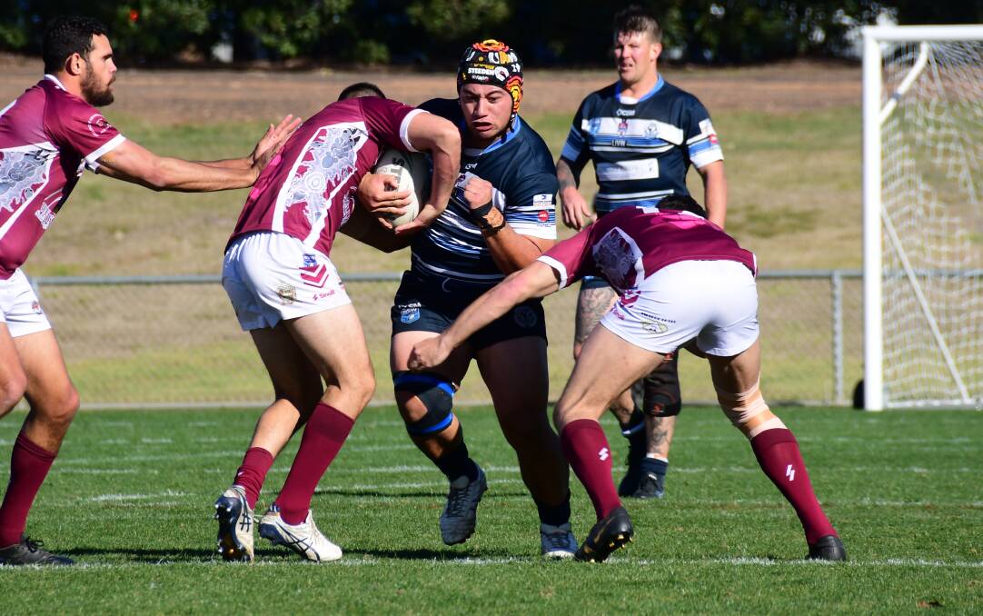 STOPPED: Lopeti Mafi and the Macquarie Raiders finished the Group 11 first grade season in fourth spot on the ladder. Photo: AMY McINTYRE