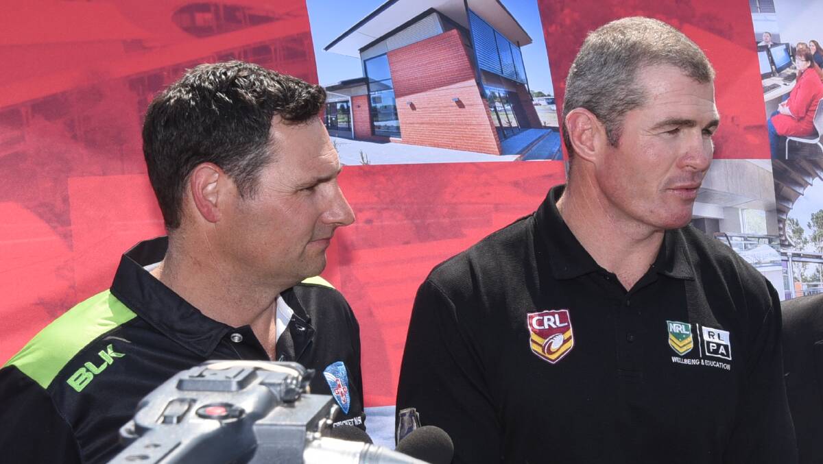 PROUD: Tim Cox (left) and former Australian rugby league representative Andrew Ryan  speak to the media following Tuesday's announcement. Photo: BELINDA SOOLE