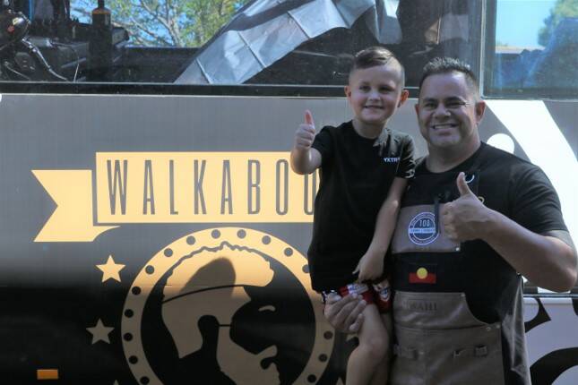 LOOKING SHARP: Ace Bell gives Brian Dowd and the Walkabout Barber service a big thumbs up! Photo: TORIN HANDO