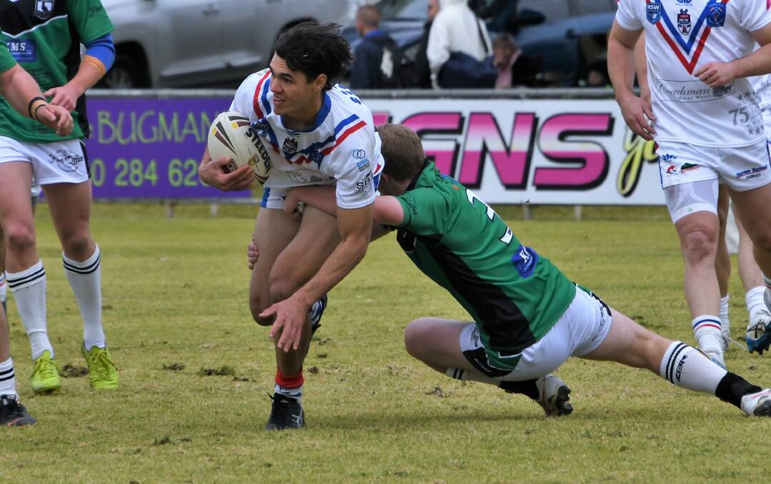 HUGE GAME: Parkes winger Jacob Smede is greeted by a wall of Forbes defenders in June's derby. Photo: JENNY KINGHAM.
