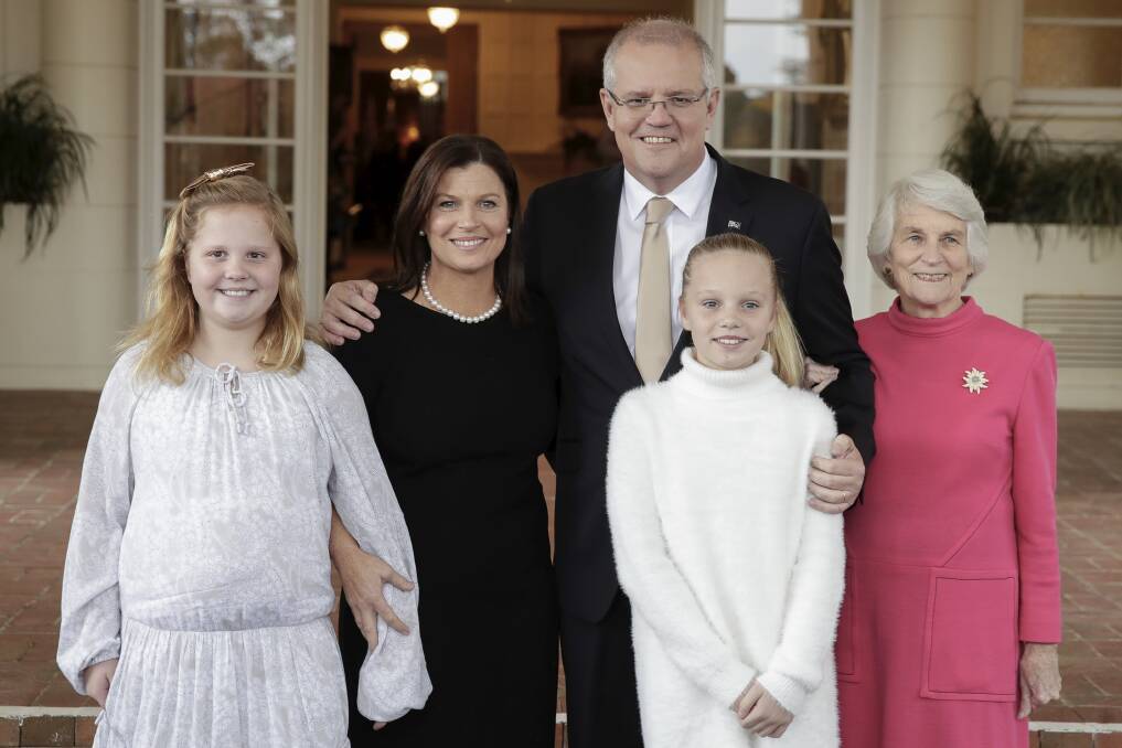 Prime Minister Scott Morrison with daughter Abbey, wife Jenny, daughter Lily and mother Marion pose for a photo after the swearing-in ceremony of his ministry. Picture: Alex Ellinghausen
