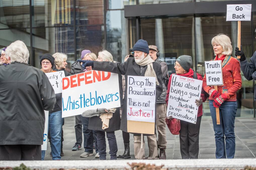 Protesters demonstrate in support of Witness K and Bernard Collaery outside the ACT courts. Picture: Karleen Minney