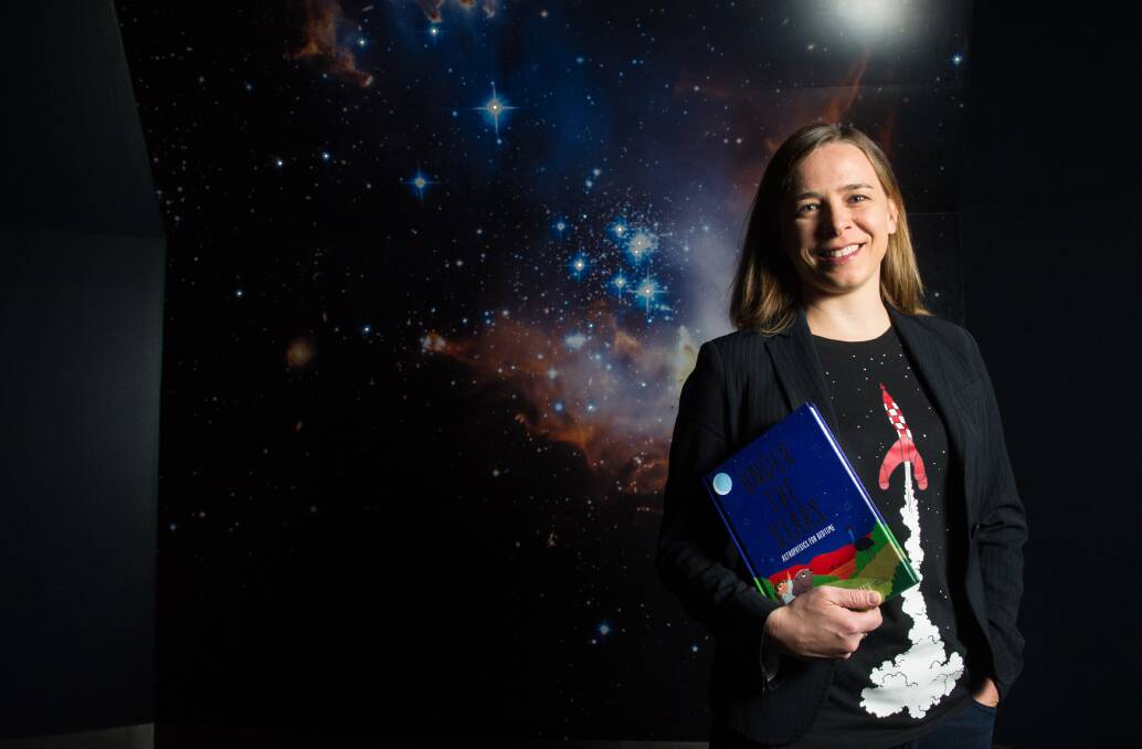 Astrophysicist and Women in STEM ambassador Lisa Harvey-Smith with her children's book Under the Stars: Astrophysics for Bedtime. Picture: Elesa Kurtz
