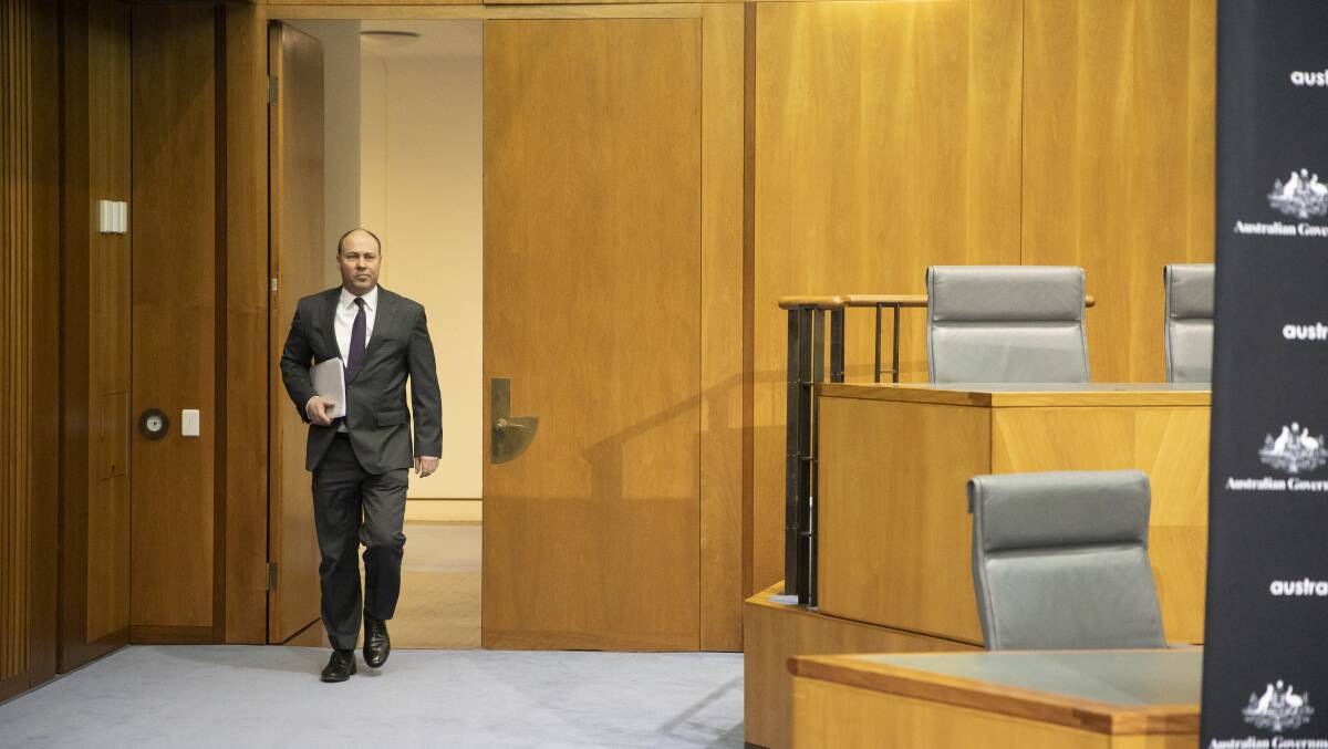 Treasure Josh Frydenberg arrives to deliver the economic and fiscal update. Picture: Sitthixay Ditthavong