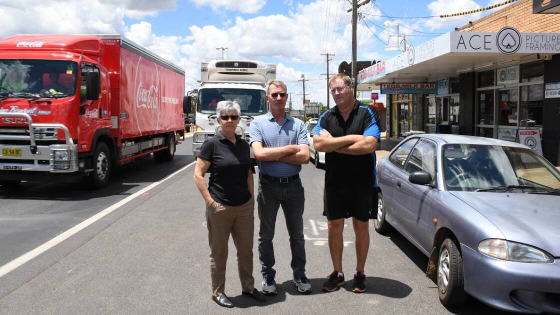 NOT HAPPY: Kath Skinner, Terry Skinner and Greg Freeman say an RMS plan to take shopfront parking away will destroy their businesses. Photo: BELINDA SOOLE.