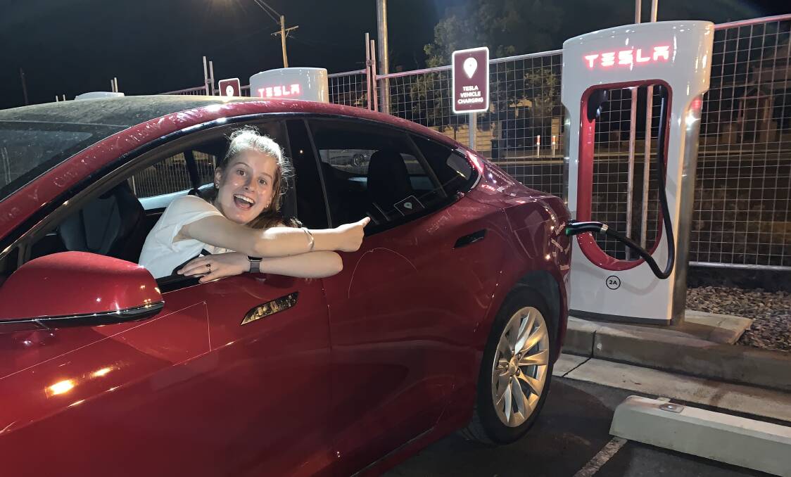 POWER UP: Julia Dickerson at the Tesla supercharger station that was opened earlier this week in the Western Plains Cultural Centre's car park.