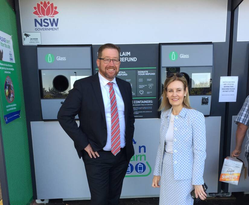 Cleaning up: Member for Dubbo Troy Grant with NSW Minister for the Environment Gabrielle Upton\ at one of the deposit schemes in the area.