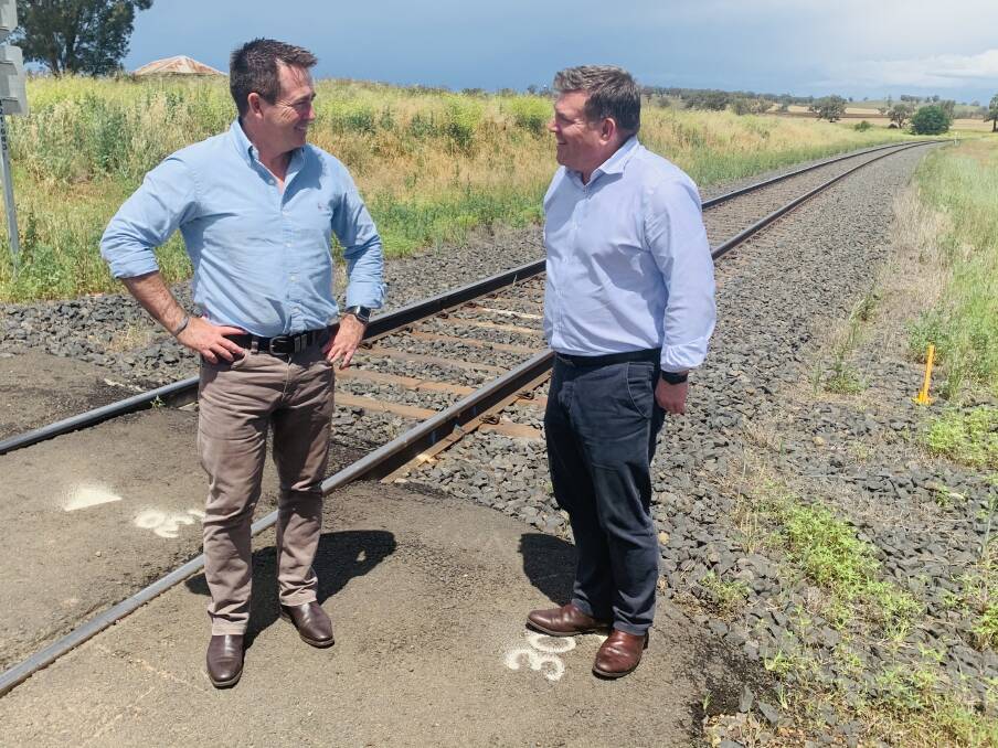 Member for the Dubbo Electorate Dugald Saunders and Regional Roads and Transport Minister Paul Toole inspect the rail line at Maryvale.