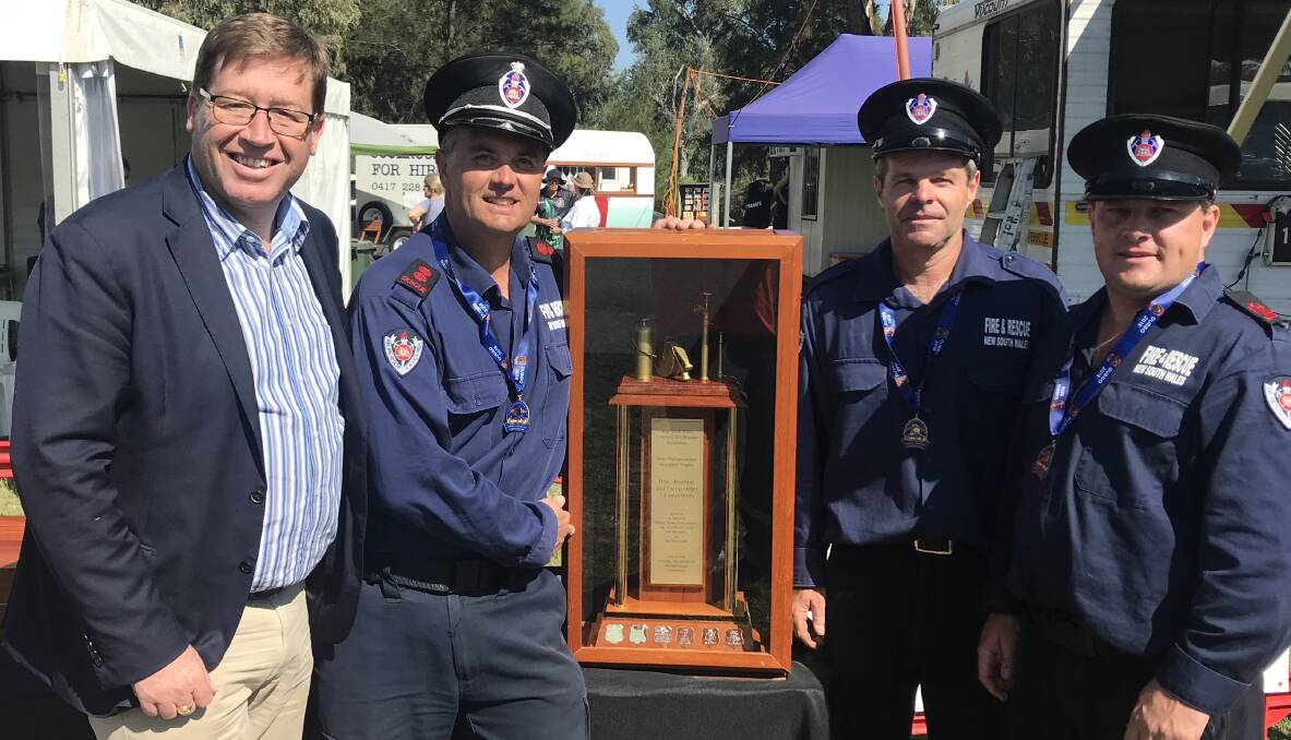 Member for Dubbo Troy Grant with members of the Nowra Fire and Rescue squad, who won the Hydrant and Pump category of the State Firefighting Championships.