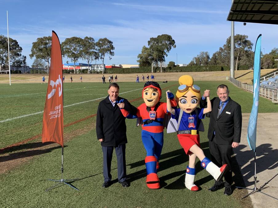Newcastle Jets CEO Laurie McKinna and Mayor of the Dubbo Region Ben Shields with Jetman and Jetgirl.