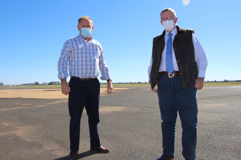 Federal Member for Parkes Mark Coulton (right) and Narromine Shire Council Mayor Craig Davies at Narromine Airport, which will undergo a number of important upgrades thanks to $389,000 in Federal Government funding through Round 2 of the Regional Airports Program.