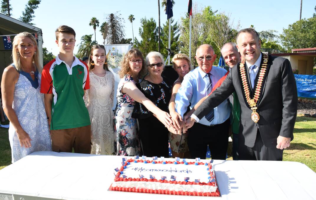 The 2019 Dubbo Australia Day award recipients cutting the celebratory cake with Dubbo Regional mayor Ben Shields. Photo: AMY McINTYRE