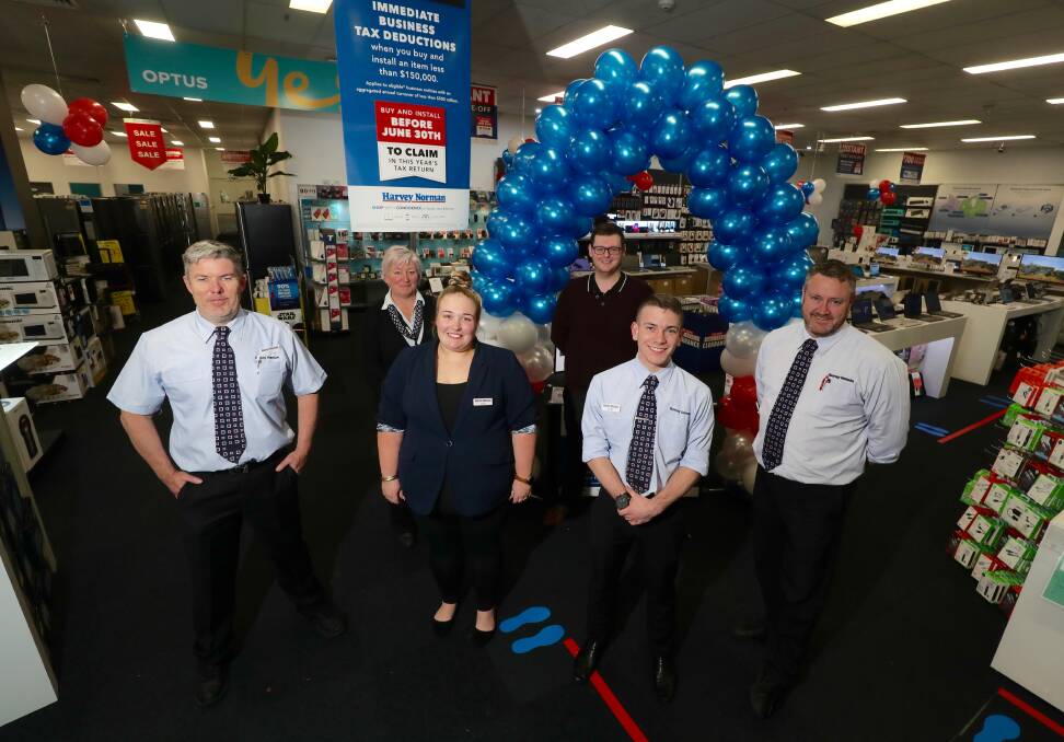 EXCITING TIMES AHEAD: Harvey Norman Bathurst team members are looking forward to having a bigger store. Photo: PHIL BLATCH