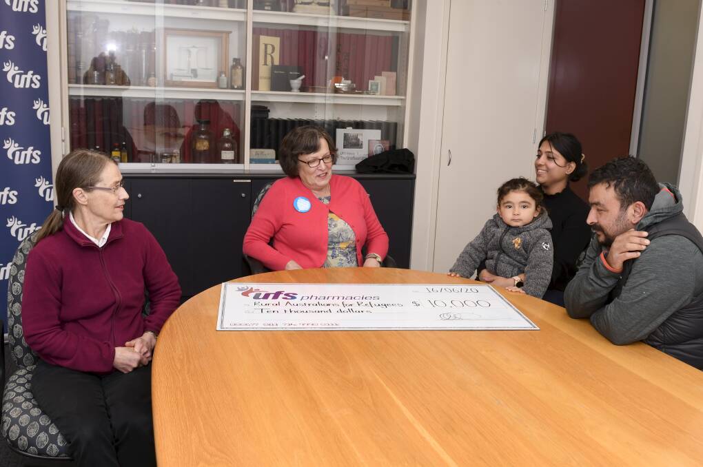 BAR Convener Mrs Margaret O'Donnell, UFS CEO Lynne McLennan, Susan Dahal 4 Year old Suyog Dahal Raj Dahal with the $10,000 cheque. Photo: Lachlan Bence