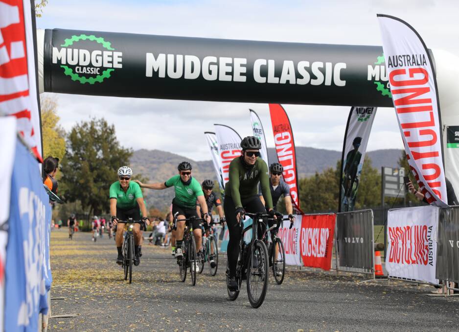 CYCLE: A group of riders cross the Mudgee Classic finish line in 2021. Picture: SIMONE KURTZ