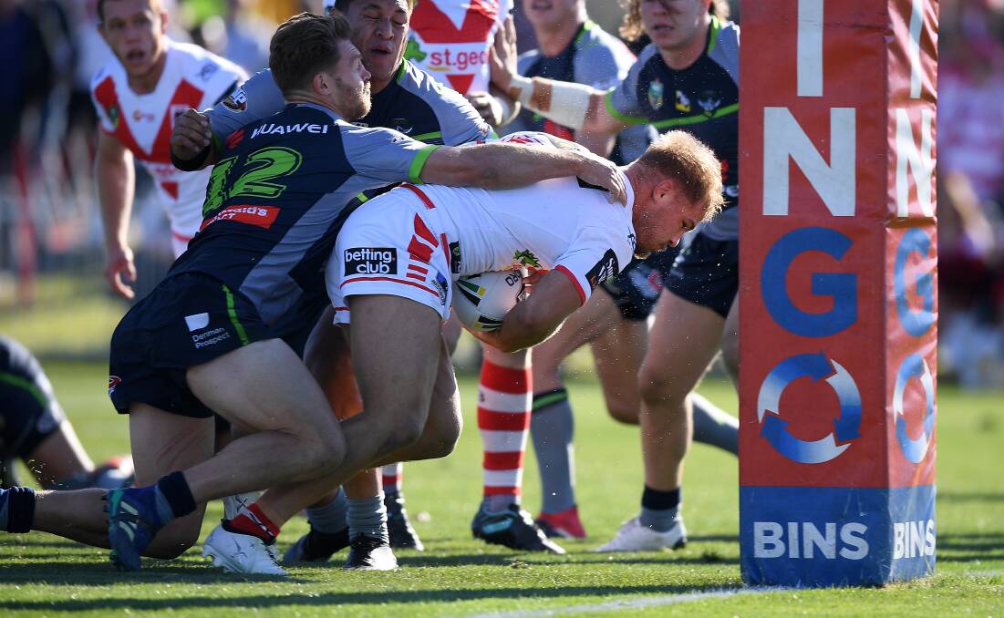 Determination: Jack De Belin goes over for a try during his team's win at Mudgee on Sunday. Photo: AAP