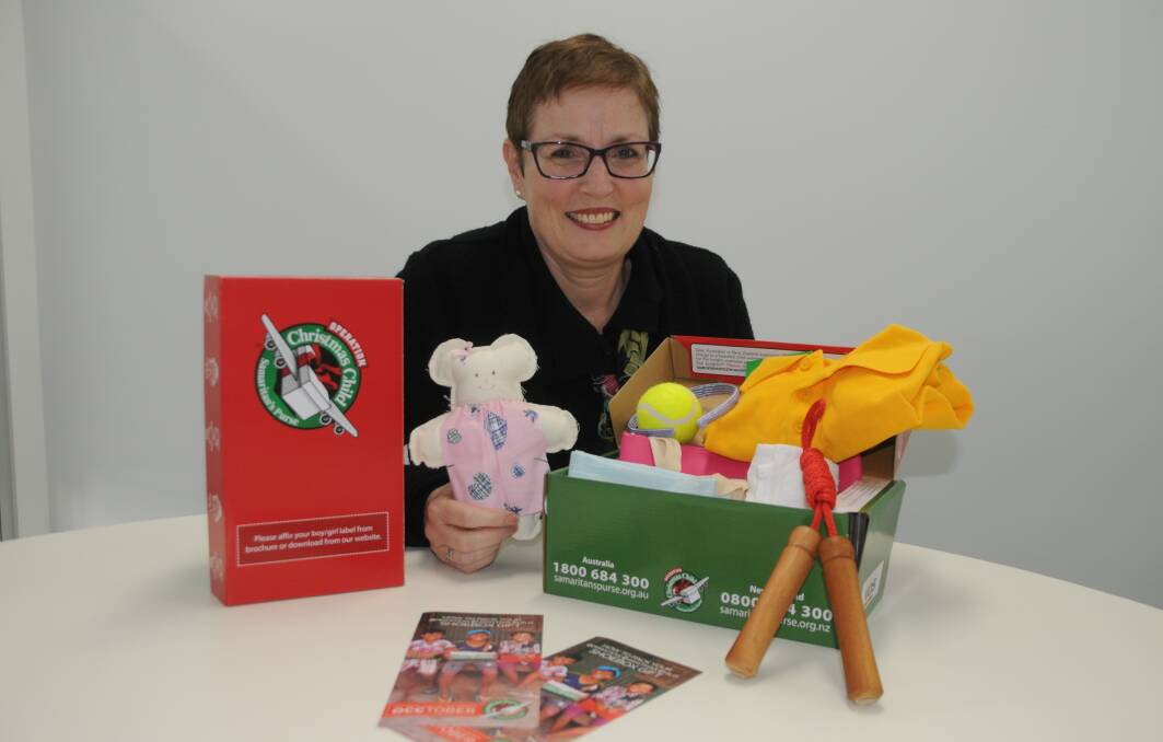 Lend a hand: Operation Christmas Child area co-ordinator Sylvia Paice with some examples of completed shoeboxes. Photo: MARK RAYNER