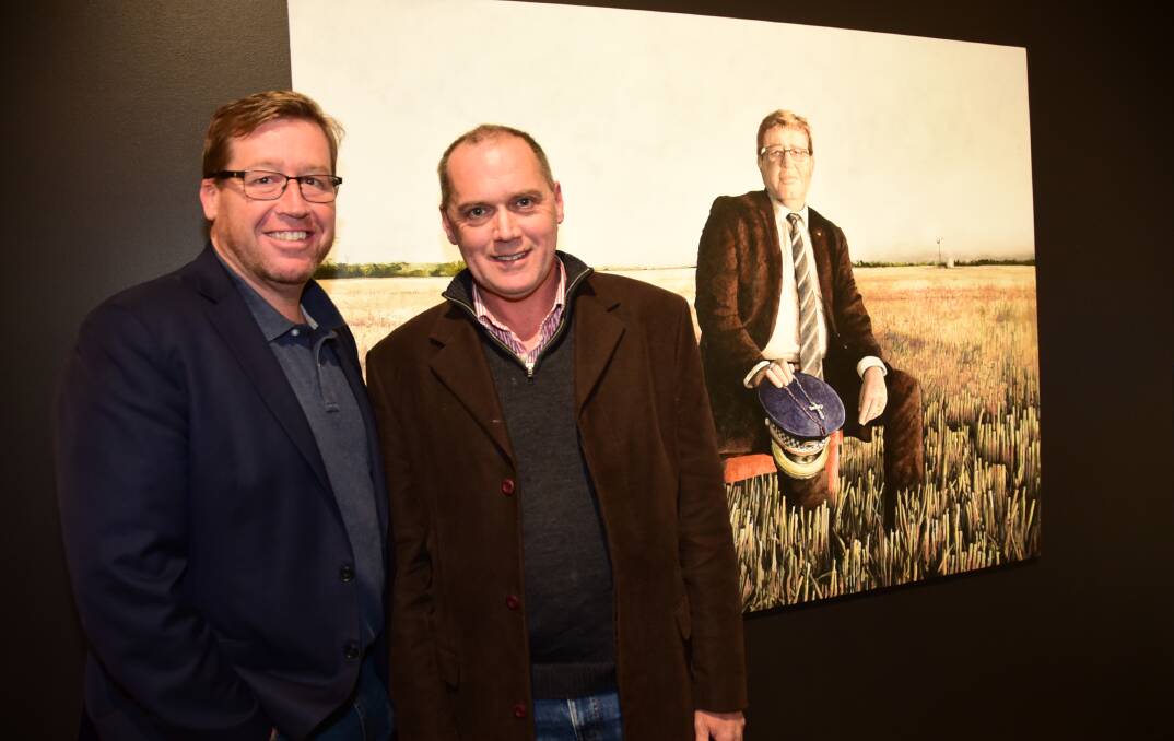 Subject and artist: Troy Grant and Mark Horton with Mr Horton's 2016 Archibald Prize finalist "Troy" at the Western Plains Cultural Centre at the exhibition opening last Friday night. Photo: PAIGE WILLIAMS