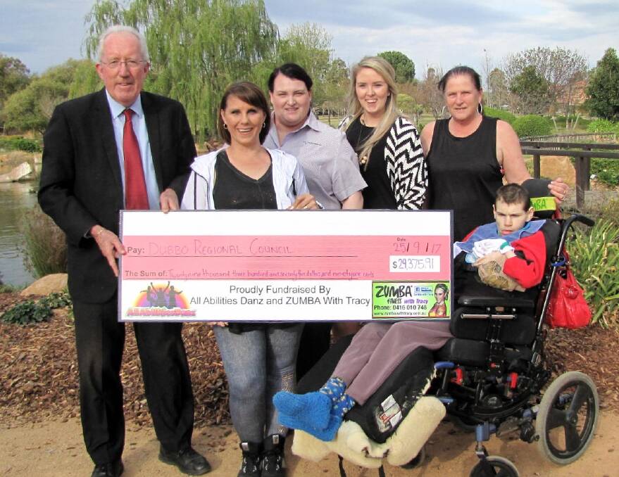 Goal reached: Dubbo Regional Council Administrator Michael Kneipp with liberty swing supporters Tracy Hanna, Rebecca Higgs, Erinn Fletcher, Lynn and Daniel Barnes.