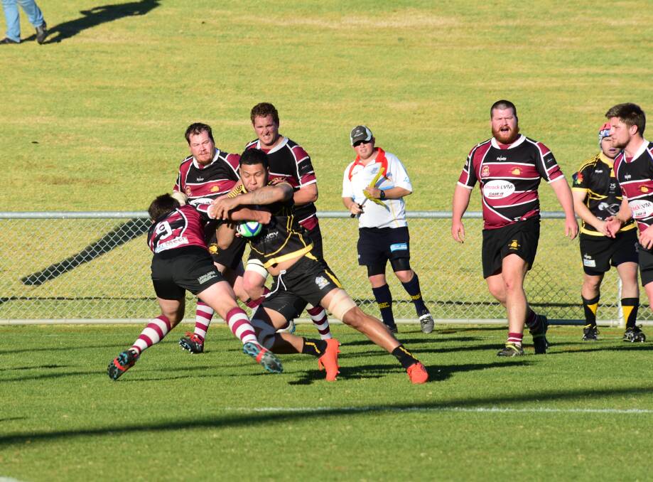Trying: The Dubbo Rhinos got their fourth win of the year against a struggling Parkes side. Photo: BELINDA SOOLE