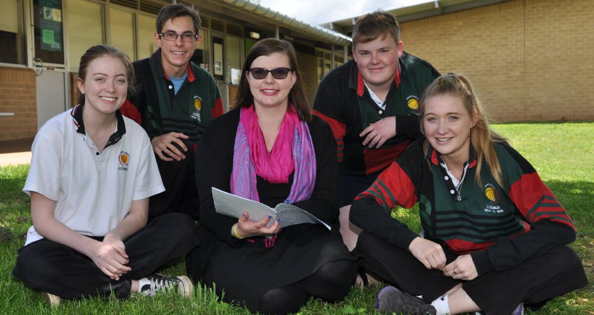 Study time: Year 12 students Zoe Webber, Nicholas Trappett, Tom Broome and Amelia Prince with English teacher Marie Speer (centre) after their first exam. Photo: ROBYN YEO