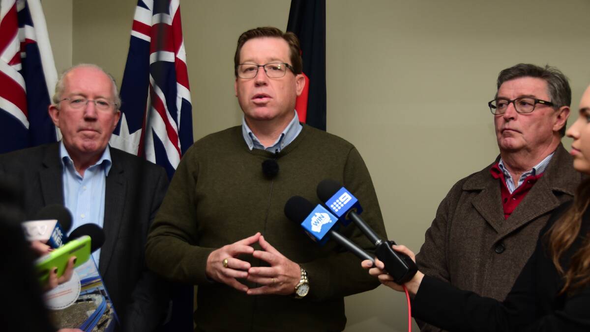 BIG ISSUE: Troy Grant, pictured with Michael Kneipp and Des Kennedy, is urging residents to fill in a survey about their position on euthanasia. 