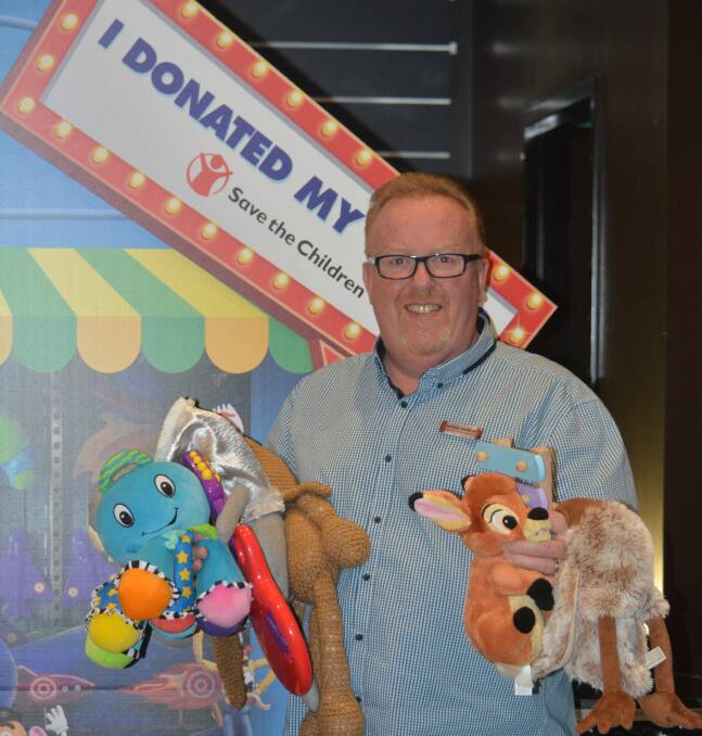 Generous: Reading Cinemas Dubbo cinema complex manager Michael Wakelam with some of the toys donated for Save the Children to distribute. Photo: FAYE WHEELER
